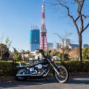 Preview wallpaper motorcycle, bike, black, buildings, tower
