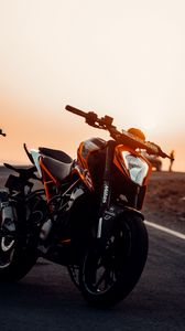 Preview wallpaper motorcycle, bike, front view, headlight, sunset