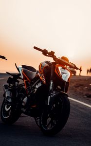 Preview wallpaper motorcycle, bike, front view, headlight, sunset