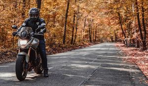 Preview wallpaper motorcycle, bike, motorcyclist, helmet, road, autumn