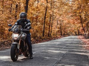 Preview wallpaper motorcycle, bike, motorcyclist, helmet, road, autumn