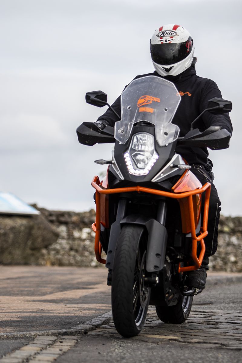 800x1200 Wallpaper motorcycle, bike, motorcyclist, helmet, road