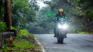 Preview wallpaper motorcycle, bike, motorcyclist, biker, headlights, road, rain