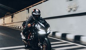 Preview wallpaper motorcycle, black, motorcyclist, speed, road