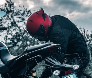 Preview wallpaper motorcycle, black, motorcyclist, helmet