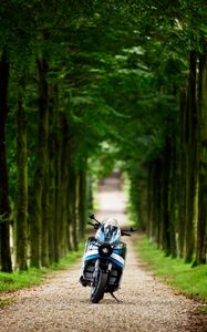 Preview wallpaper motorcycle, blue, forest, trees
