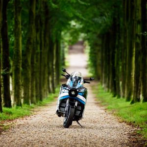 Preview wallpaper motorcycle, blue, forest, trees