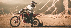 Preview wallpaper motorcycle, cross, motorcyclist, mountains, off-road, sand, helmet