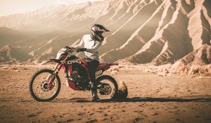 Preview wallpaper motorcycle, cross, motorcyclist, mountains, off-road, sand, helmet