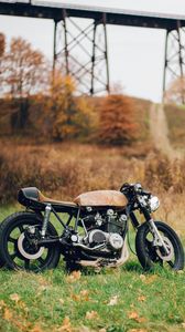 Preview wallpaper motorcycle, grass, leaves, dry