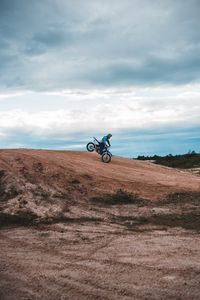 Preview wallpaper motorcycle, motorcyclist, bike, slope, sky