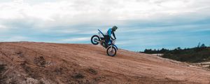 Preview wallpaper motorcycle, motorcyclist, bike, slope, sky
