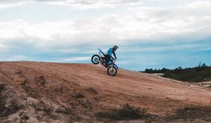 Preview wallpaper motorcycle, motorcyclist, bike, slope, sky