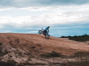 Preview wallpaper motorcycle, motorcyclist, bike, slope, sky