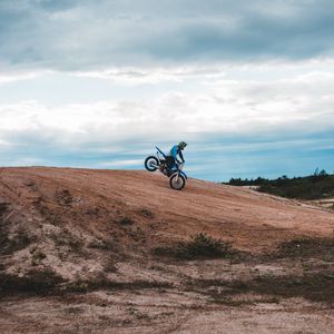 Preview wallpaper motorcycle, motorcyclist, bike, slope, sky