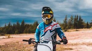 Preview wallpaper motorcycle, motorcyclist, bike, helmet, front view, sand