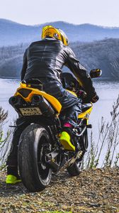 Preview wallpaper motorcycle, motorcyclist, biker, bike, moto, yellow