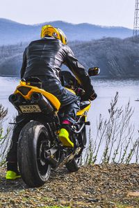 Preview wallpaper motorcycle, motorcyclist, biker, bike, moto, yellow