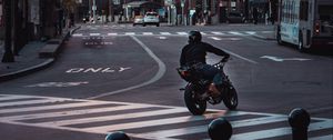 Preview wallpaper motorcycle, motorcyclist, black, road, city, traffic lights