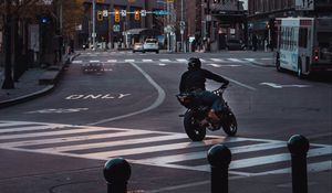 Preview wallpaper motorcycle, motorcyclist, black, road, city, traffic lights