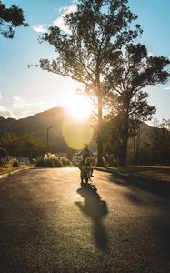 Preview wallpaper motorcycle, motorcyclist, child, road, sunset