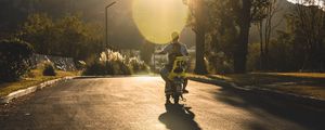 Preview wallpaper motorcycle, motorcyclist, child, road, sunset