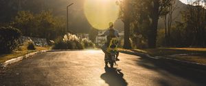 Preview wallpaper motorcycle, motorcyclist, child, road, sunset