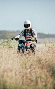 Preview wallpaper motorcycle, motorcyclist, field, grass