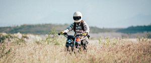 Preview wallpaper motorcycle, motorcyclist, field, grass