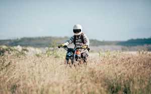 Preview wallpaper motorcycle, motorcyclist, field, grass