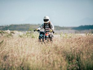 Preview wallpaper motorcycle, motorcyclist, field, grass