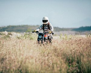 Preview wallpaper motorcycle, motorcyclist, field, grass