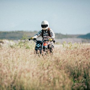 Preview wallpaper motorcycle, motorcyclist, field, grass