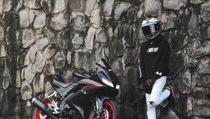 Preview wallpaper motorcycle, motorcyclist, helmet, bike, wall