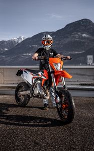Preview wallpaper motorcycle, motorcyclist, helmet, bike, orange