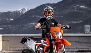 Preview wallpaper motorcycle, motorcyclist, helmet, bike, orange
