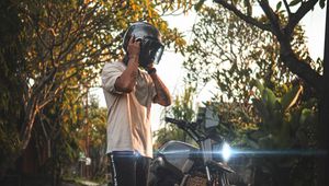 Preview wallpaper motorcycle, motorcyclist, helmet, bike, gray