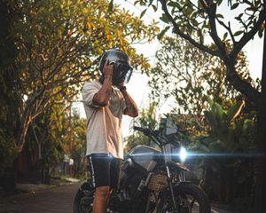 Preview wallpaper motorcycle, motorcyclist, helmet, bike, gray