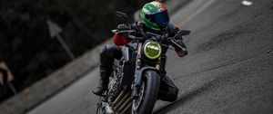 Preview wallpaper motorcycle, motorcyclist, helmet, motorcycle racing, tilt