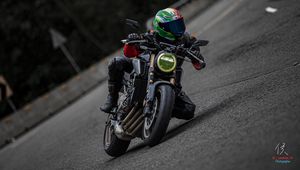 Preview wallpaper motorcycle, motorcyclist, helmet, motorcycle racing, tilt