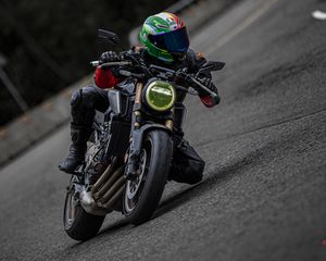 Preview wallpaper motorcycle, motorcyclist, helmet, motorcycle racing, tilt