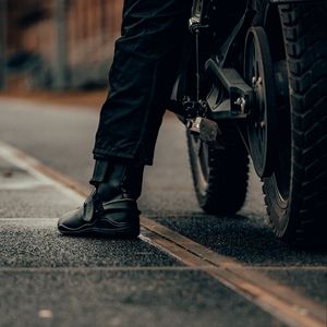 Preview wallpaper motorcycle, motorcyclist, leg, bike, black