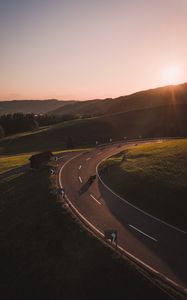 Preview wallpaper motorcycle, motorcyclist, road, hill, rays