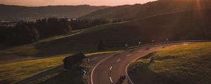 Preview wallpaper motorcycle, motorcyclist, road, hill, rays