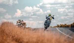 Preview wallpaper motorcycle, motorcyclist, stunt, bike, road