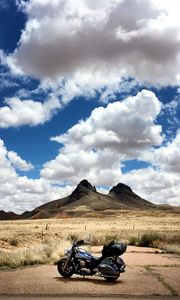 Preview wallpaper motorcycle, mountains, desert, clouds, travel