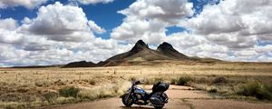 Preview wallpaper motorcycle, mountains, desert, clouds, travel