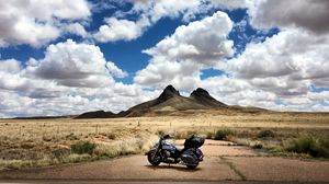 Preview wallpaper motorcycle, mountains, desert, clouds, travel