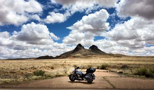 Preview wallpaper motorcycle, mountains, desert, clouds, travel