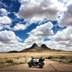 Preview wallpaper motorcycle, mountains, desert, clouds, travel